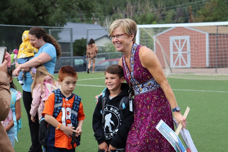 Principal and kids on PLES field 1st day of school