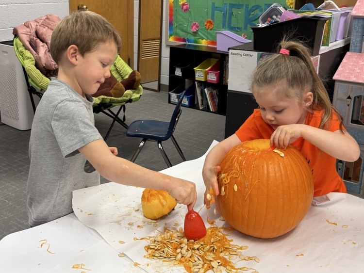 preschoolers with pumpkin