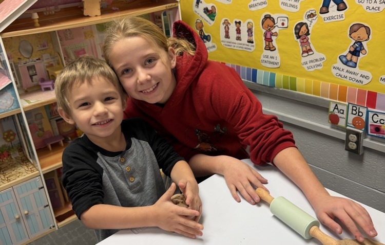 making gingerbread ornaments with buddies