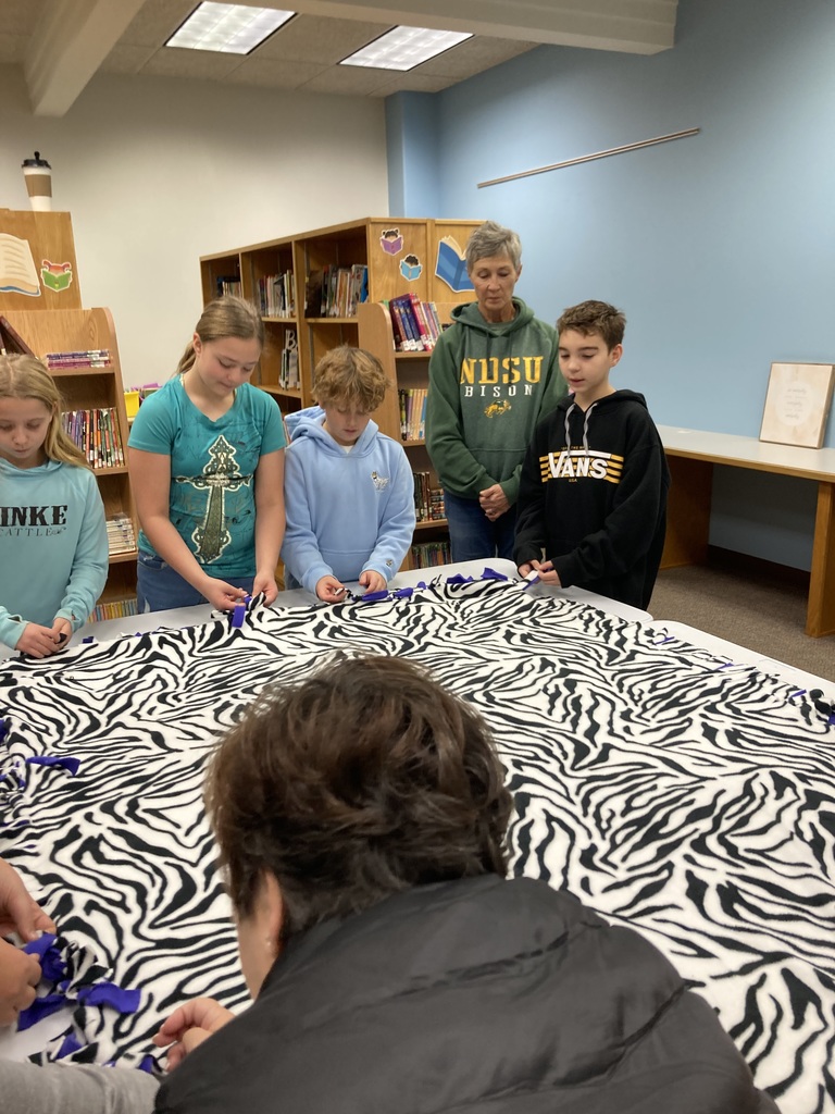 5th Grade Students Making Blankets with Helpers