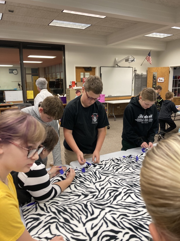 5th Grade Students Making Blankets with Helpers