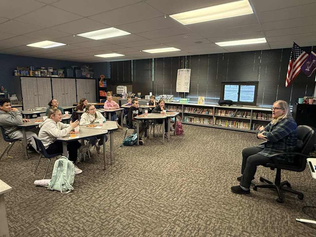 Miss Rita Telling Stories to the 6th Graders