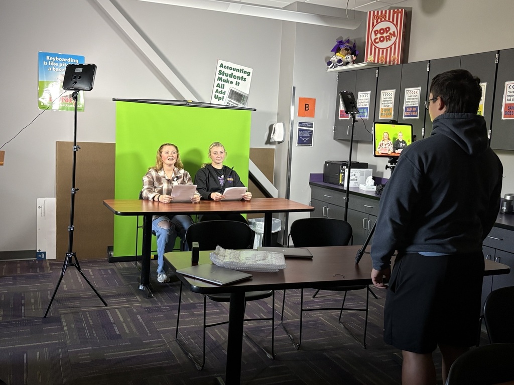 Recording of the Bomber Brief with student anchors and camera person.