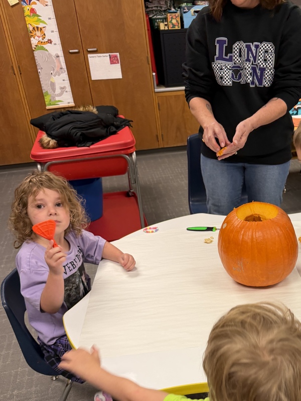 Preschoolers with pumpkins