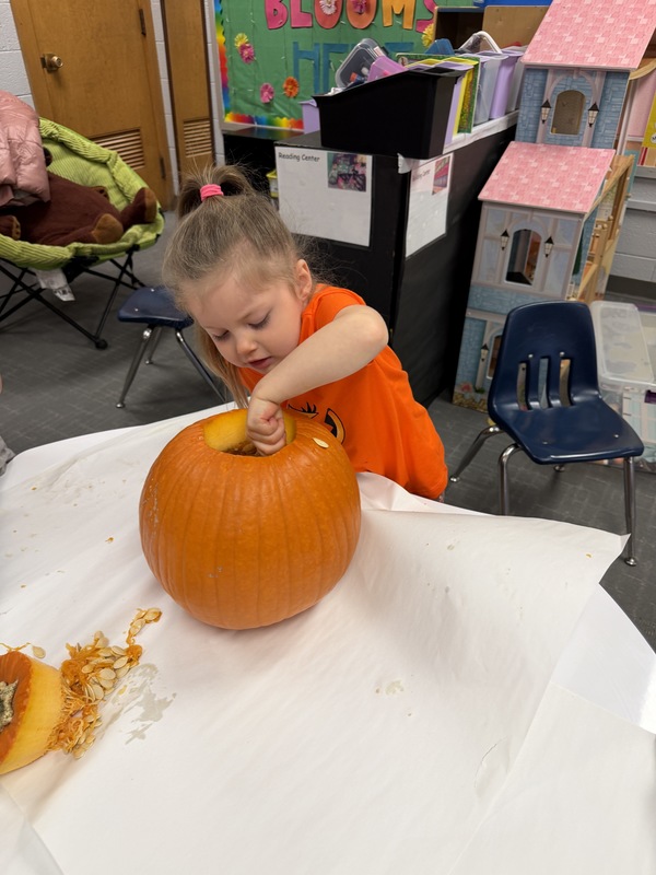 Preschoolers with pumpkins