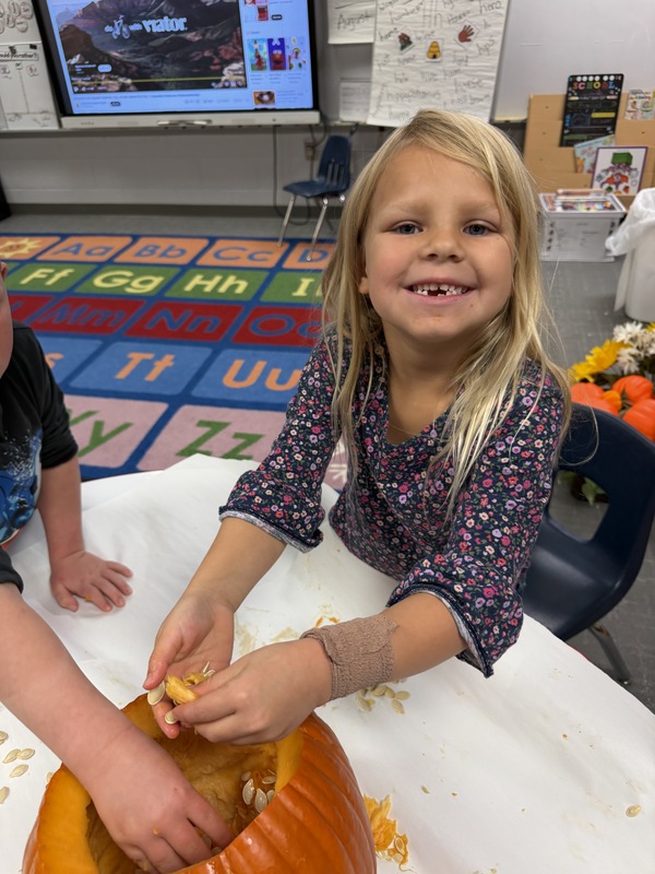 Preschoolers with pumpkins