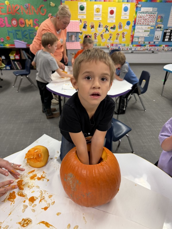 Preschoolers with pumpkins