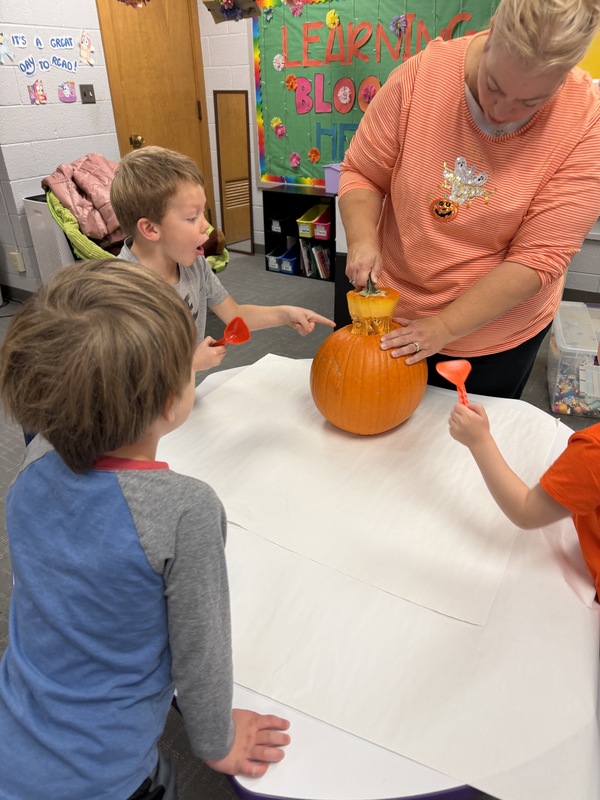 Preschoolers with pumpkins