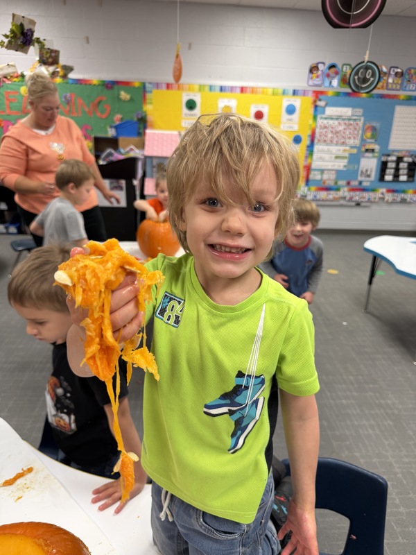 Preschoolers with pumpkins