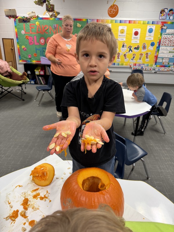 Preschoolers with pumpkins