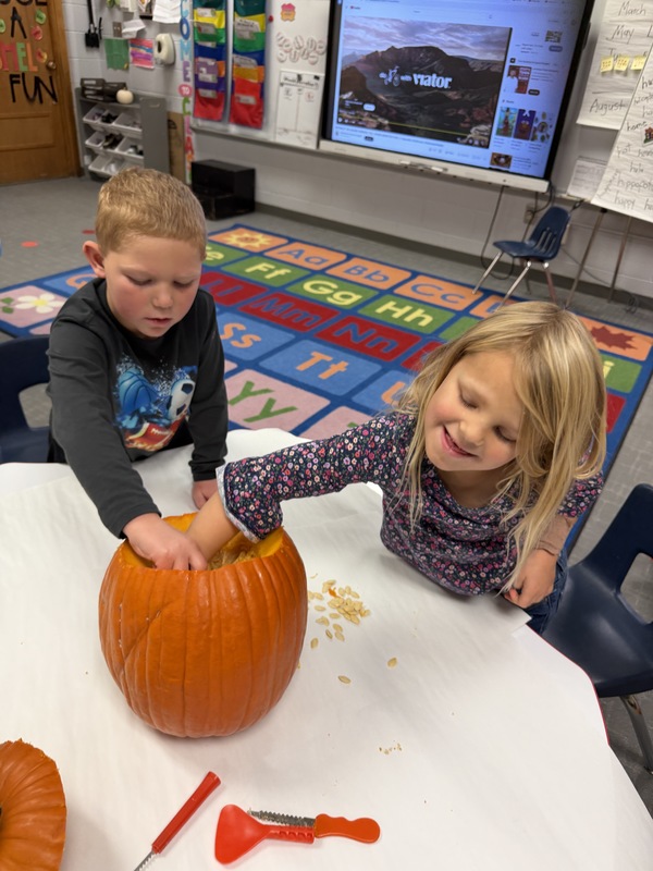 Preschoolers with pumpkins