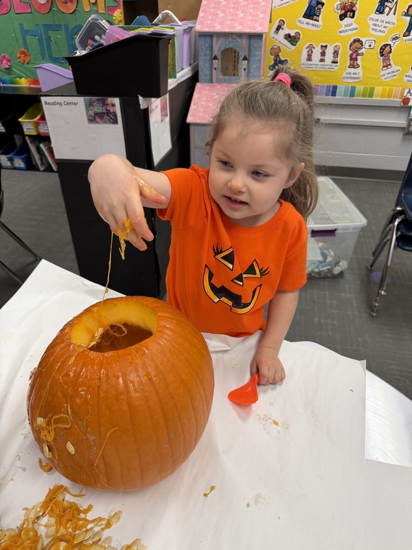 Preschoolers with pumpkins