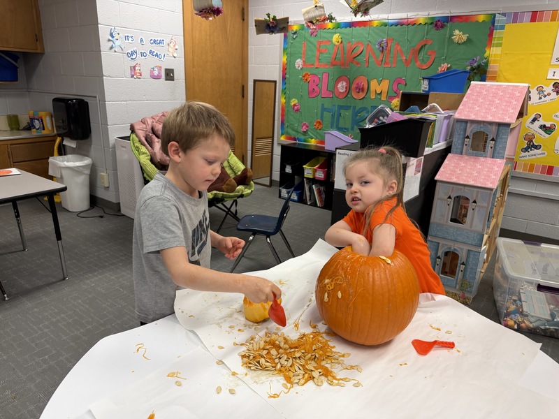 Preschoolers with pumpkins