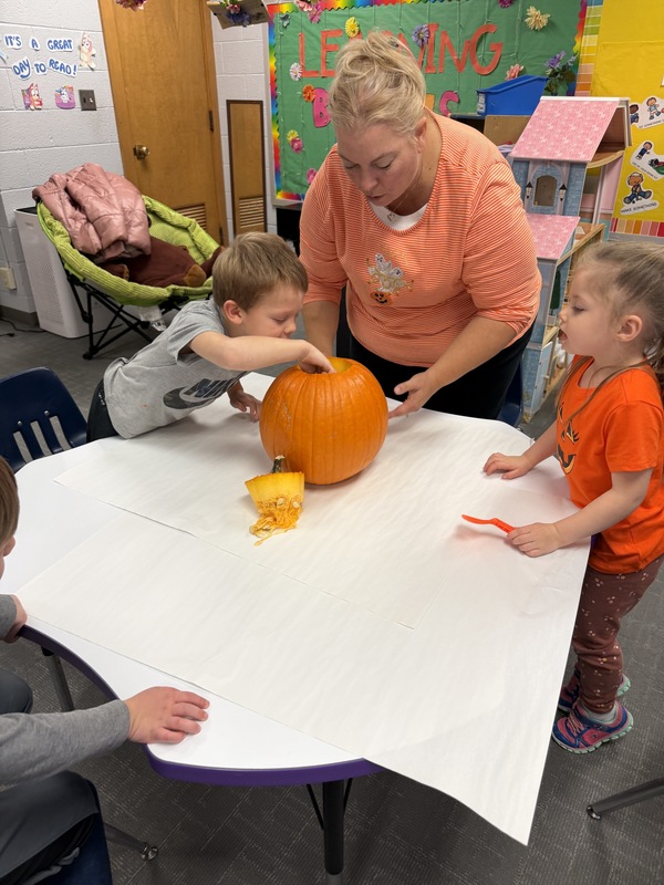 Preschoolers with pumpkins