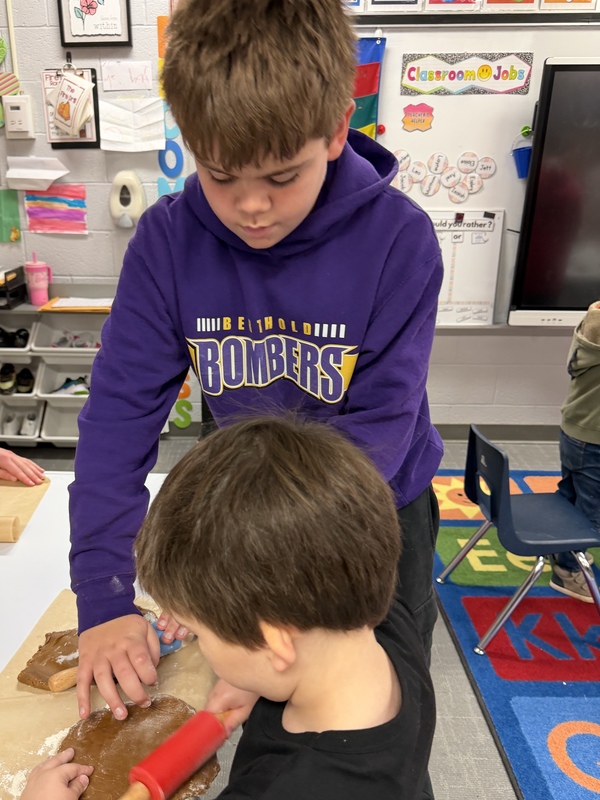 Buddies making gingerbread cookies