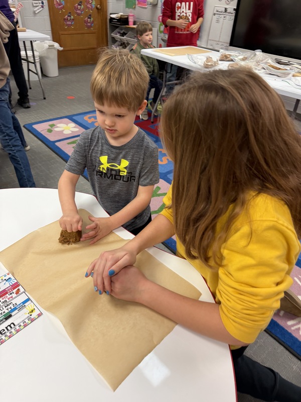 Buddies making gingerbread cookies