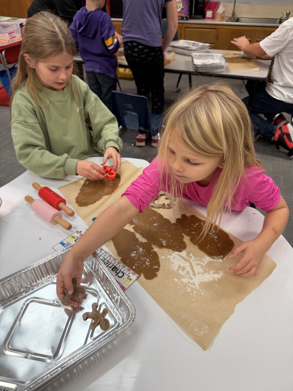 Buddies making gingerbread cookies