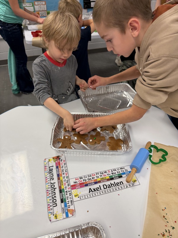 Buddies making gingerbread cookies
