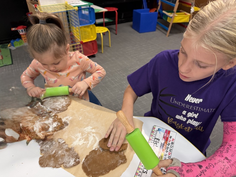 Buddies making gingerbread cookies