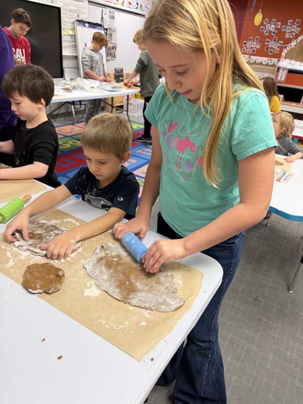 Buddies making gingerbread cookies
