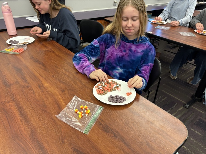 Students sorting Monster cereal.