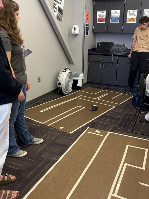 Students testing their cyber:bot in a maze.