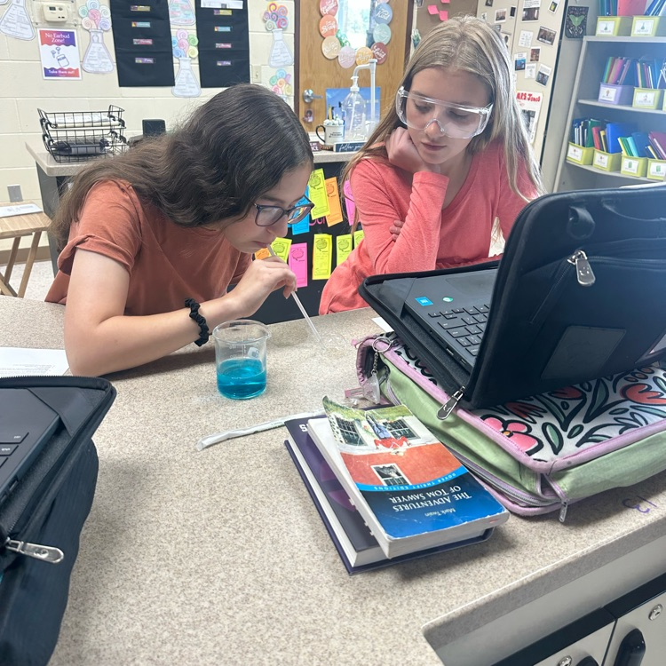 student blowing bubbles during bubble buster lab