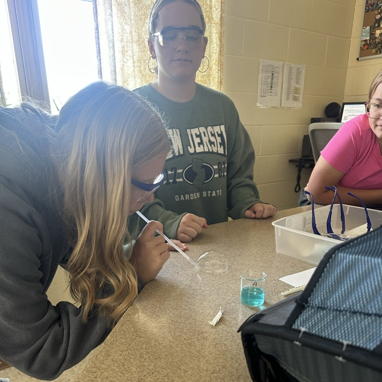 student blowing bubbles during bubble buster lab
