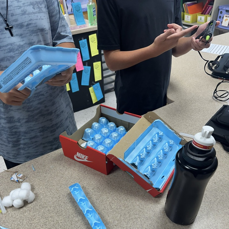 students working on soundproof boxes