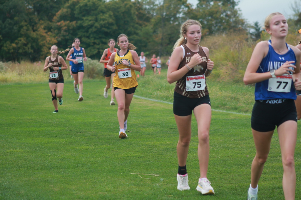 Eva Logsdon running her way to a PR a medal at the Brian T. Simpson Invite on Saturday, October 11th at Gans Creek.