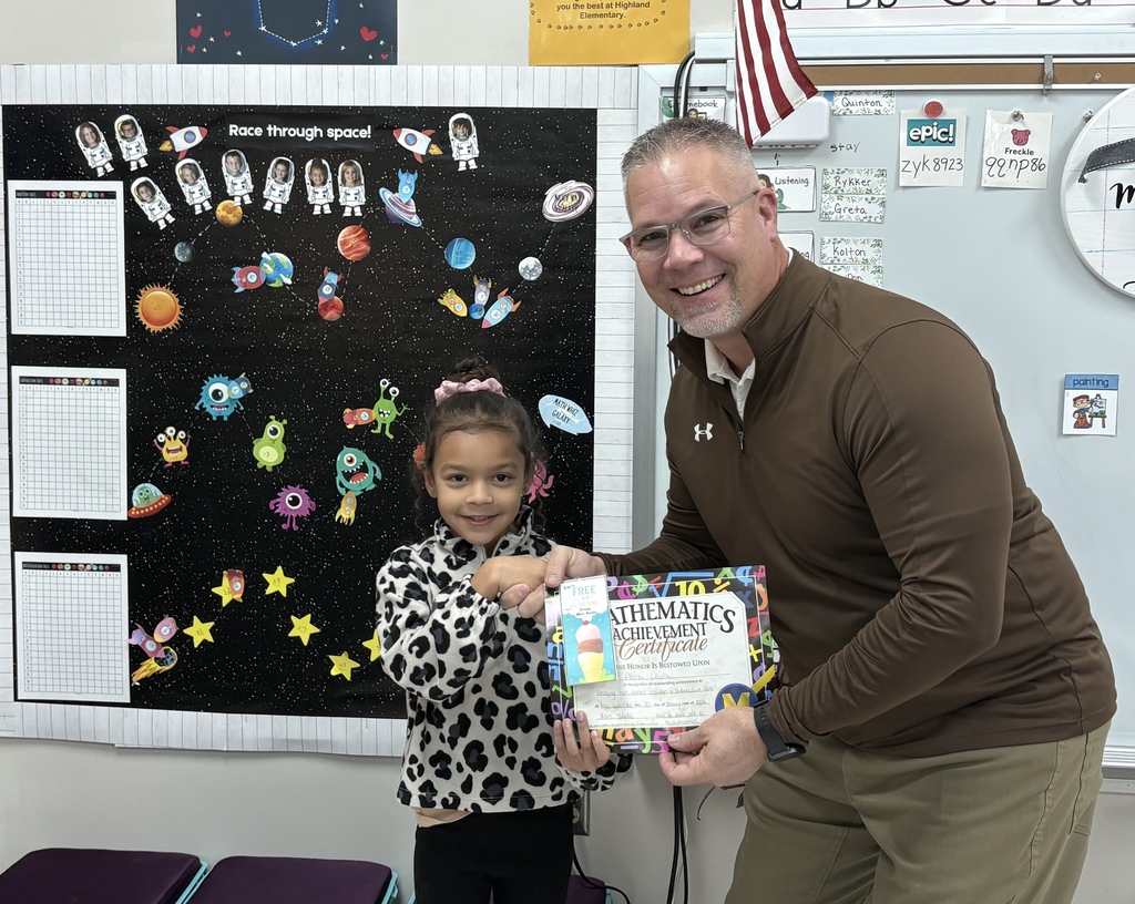 Aloni Lewis accepting her math facts award from Mr. Scifres