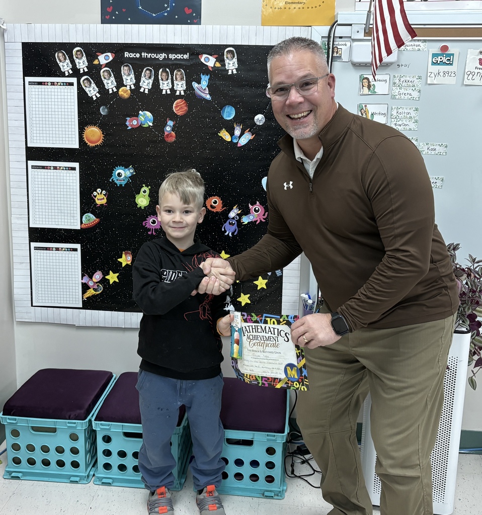 Jasper Keller accepting his math facts award from Mr. Scifres