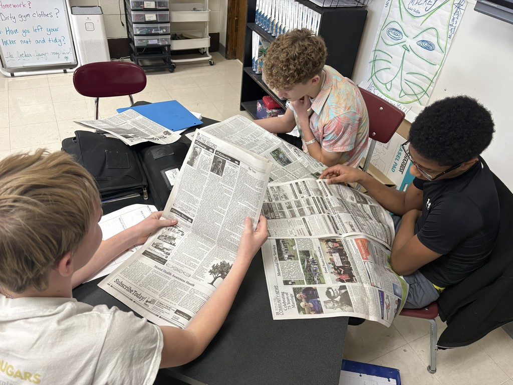 students studying local news