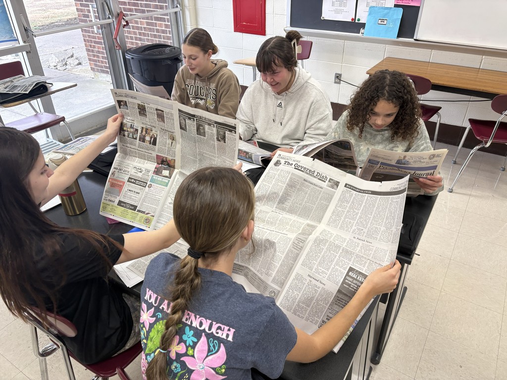 students studying local news