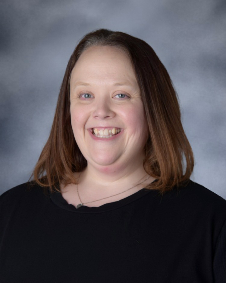 A photo of Ms. Carmody in a black blouse