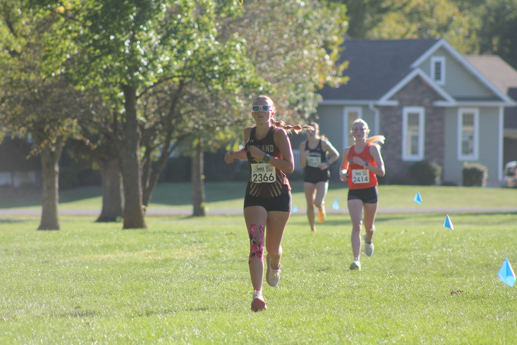 AJ Caudill sprinting into the finish at the CCC meet in the final stretch.