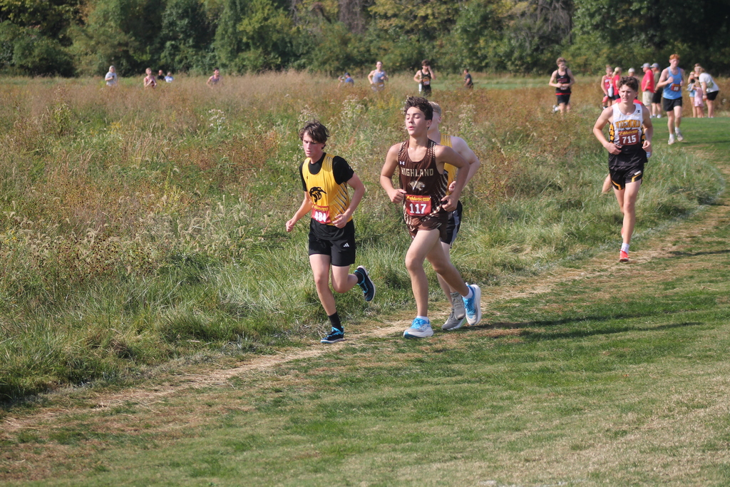 Kolten Lewis (5th for the Cougars - 160th out 233 - 22:48.5) passing a couple of Monroe City competitors at the Harrisburg meet.