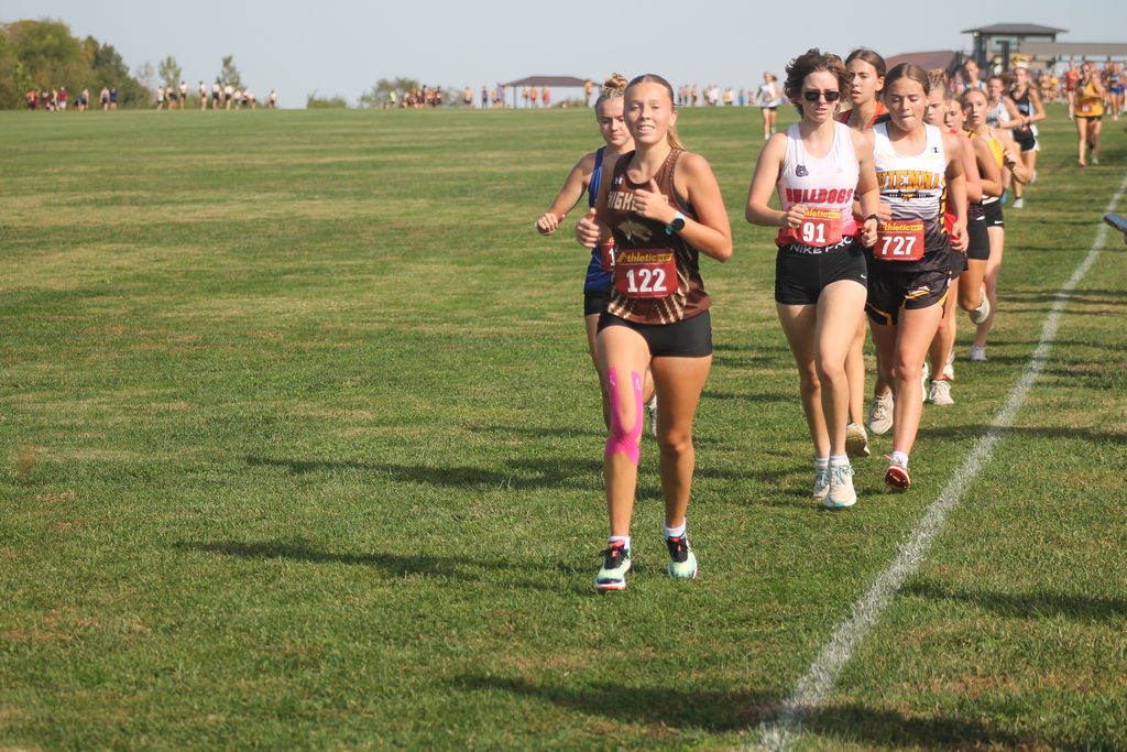 AJ Caudill leading a large pack of runners into the second and final lap of the race.