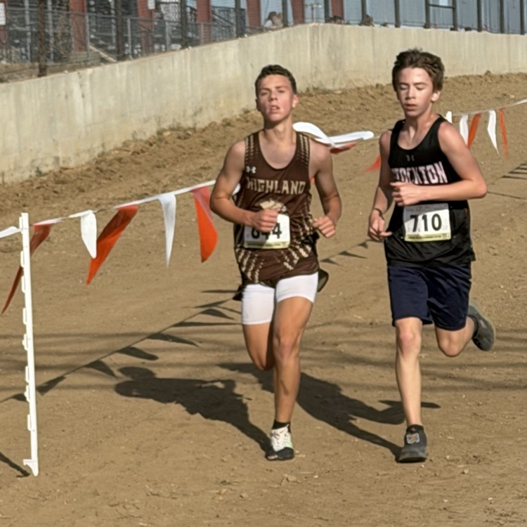 Nick Caudill in the final stretch of the race passing another runner.
