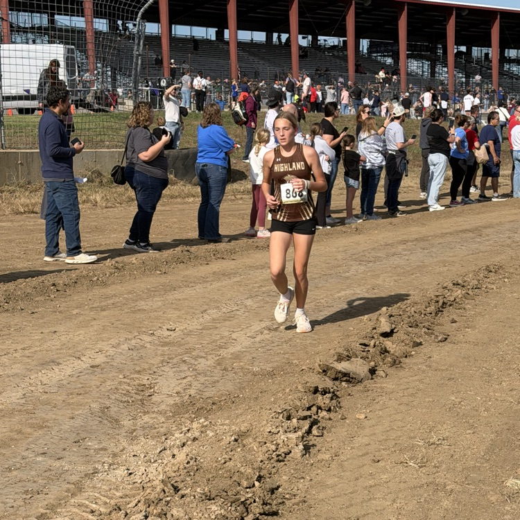 Natalie Wilson pulling away from a couple of competitors kicking into high gear at the finish to secure an All State Medal!