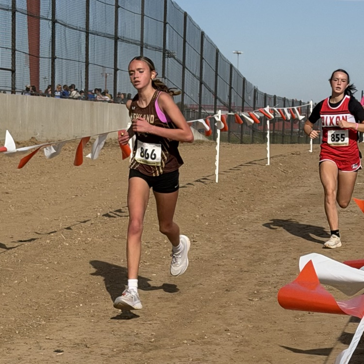 Jordyn Bringer heading into the final stretch of the 2 mile race.