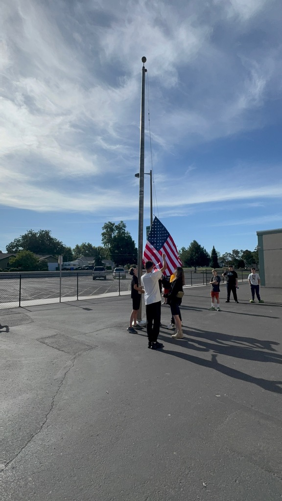 students learning how to retire the flag