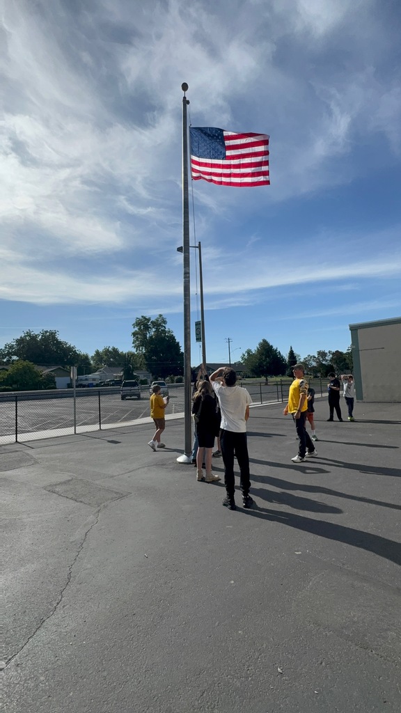 students learning how to retire the flag