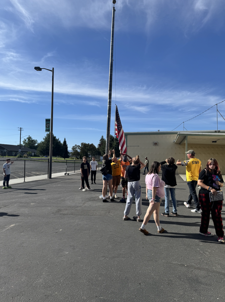 students learning how to retire the flag