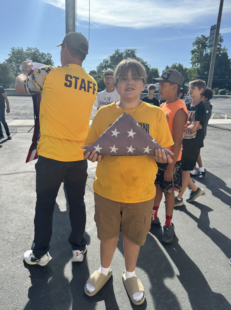 students learning how to retire the flag