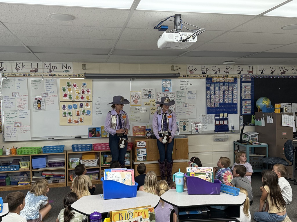 Lewiston Roundup Royalty talking with students