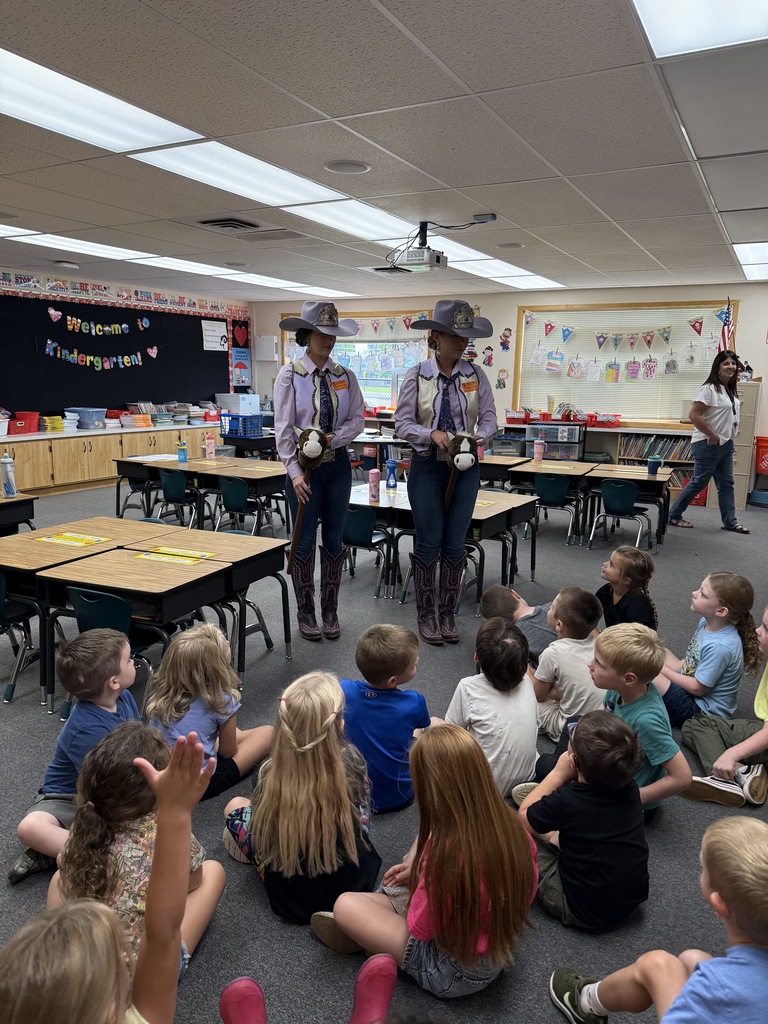 Lewiston Roundup Royalty talking with students