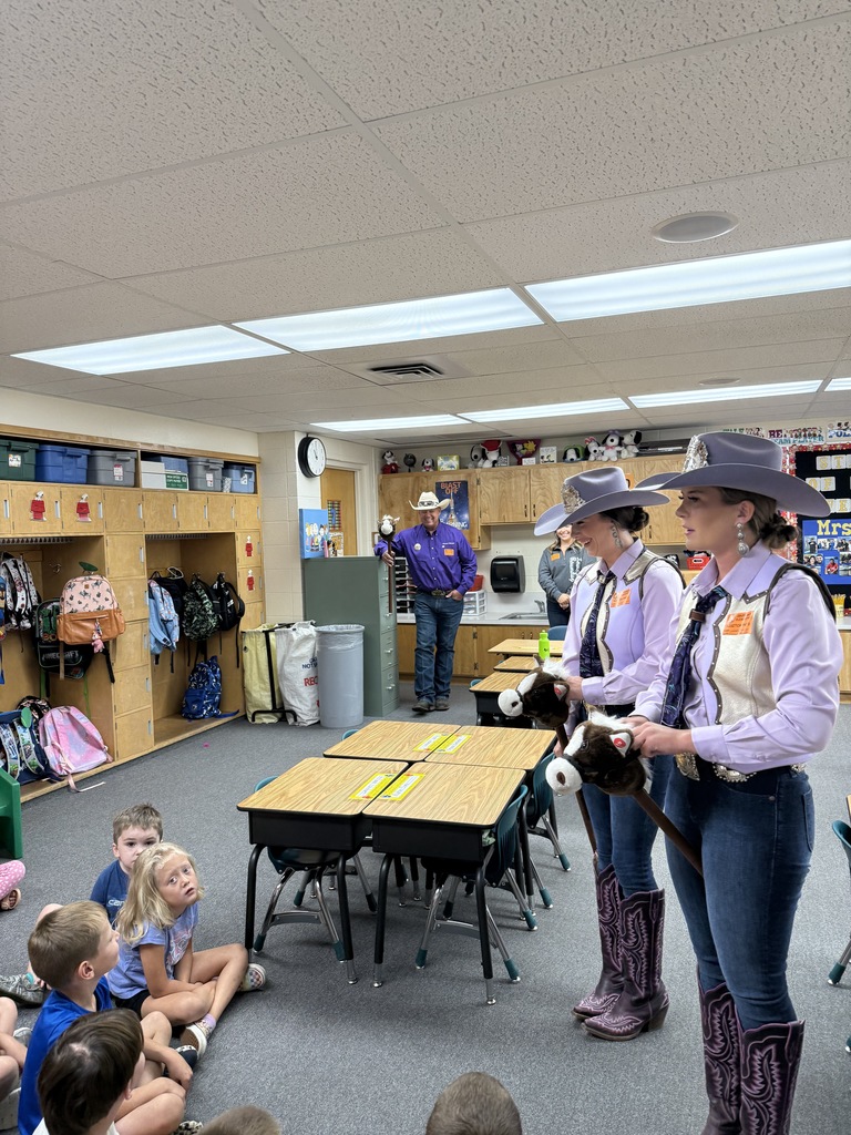 Lewiston Roundup Royalty talking with students