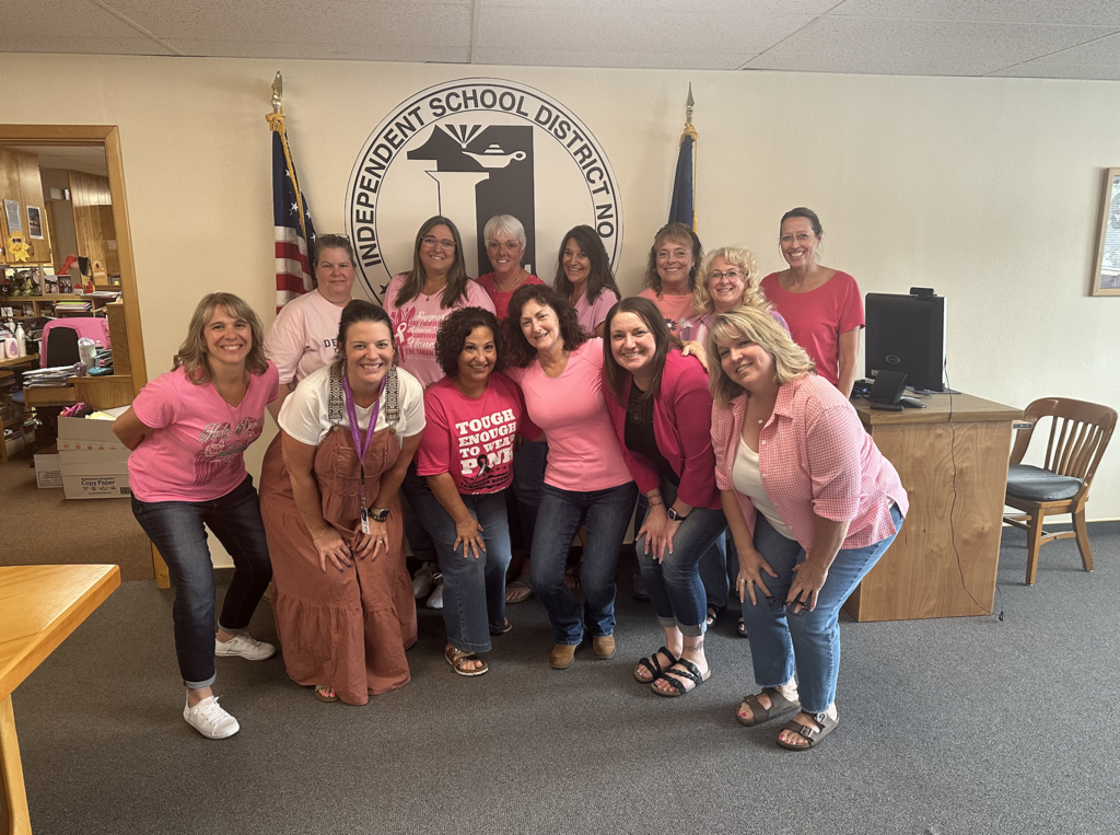 a group of women wearing pink