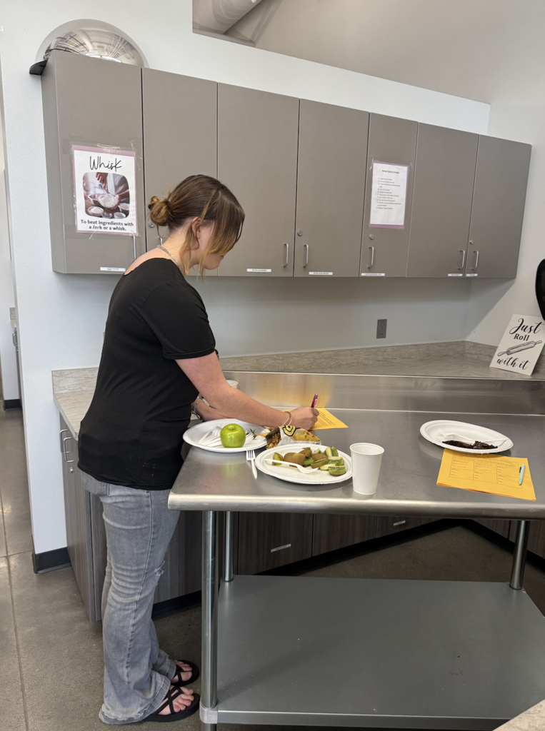 student taste testing food